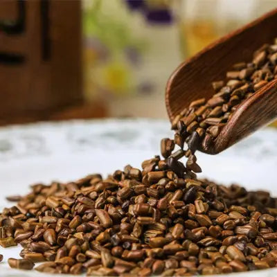 Pile of brown chrysanthemum cassia seed for liver detox and reducing abdominal fat