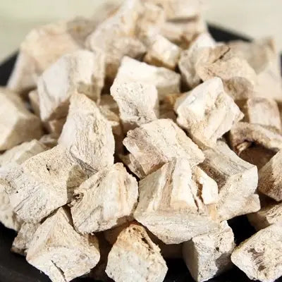 Pile of dried poria cocos roots for herbal tea with antioxidant properties