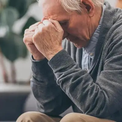 Distressed elderly man enjoying Red Bean Barley Tea supporting detoxification with tangerine peel expulsion