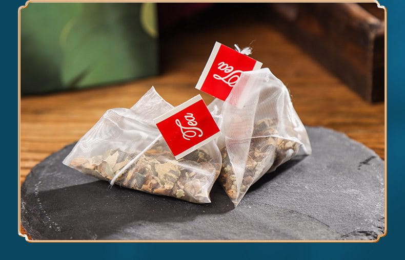 Two pyramid tea bags of slimming tea for health-enhancing herbal tea benefits