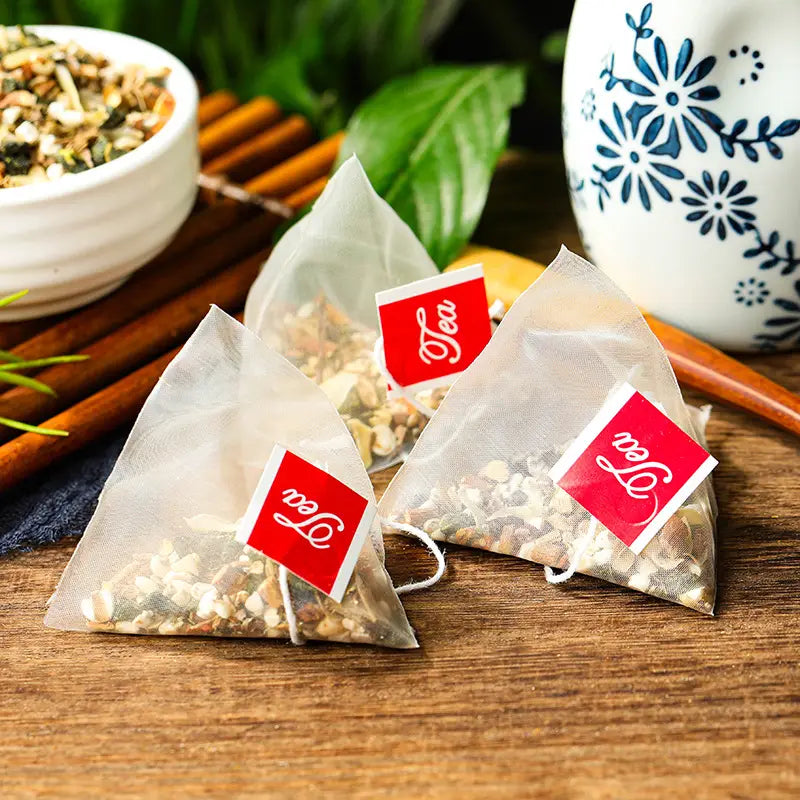 Three pyramid tea bags of Gout Tea with Poria Cocos herbal tea and antioxidant benefits