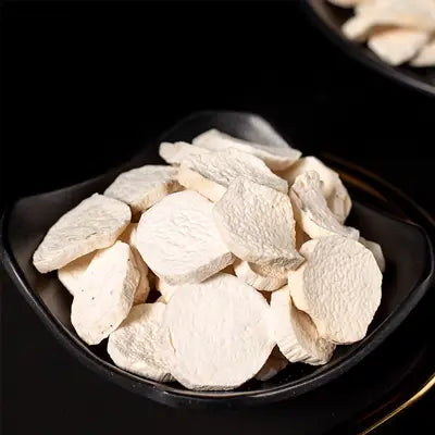 Dried sliced taro root for herbal tea promoting digestion during golden hour and irregular diet