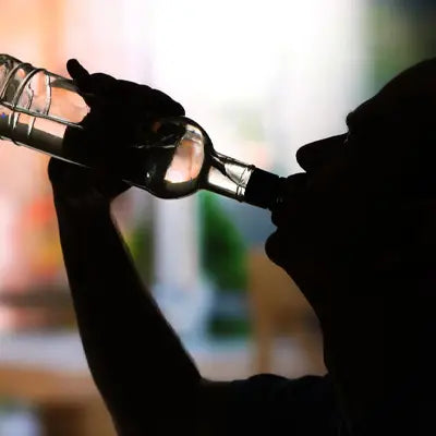 Silhouette of a person drinking herbal tea with poria cocos and antioxidant benefits