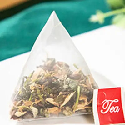 Pyramid-shaped tea bag of Colon Cleansing Tea with Tangerine Peel in Traditional Chinese Medicine