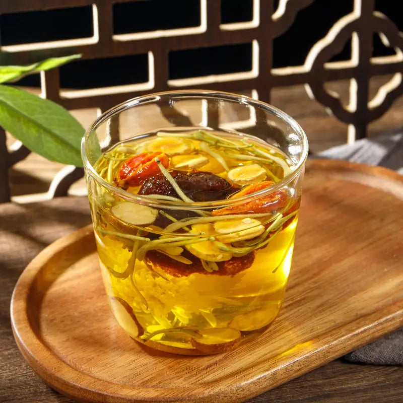 Glass of herbal tea with siraitia grosvenorii and boat-fruited sterculia for cough relief