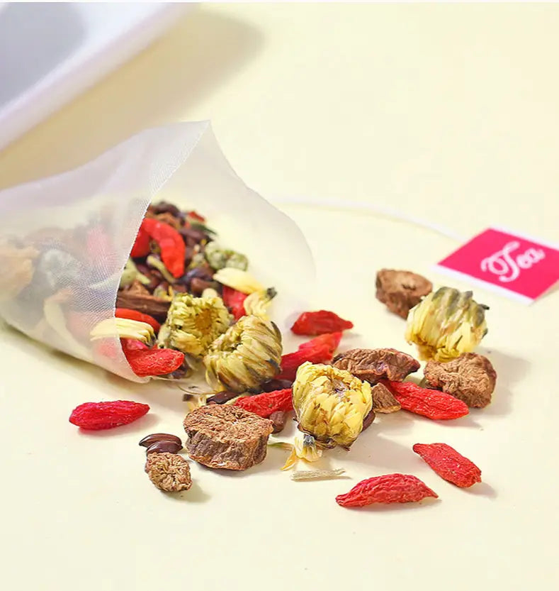 Herbal tea blend spilling from a tea bag for Liver Detox with Chrysanthemum Cassia Seed
