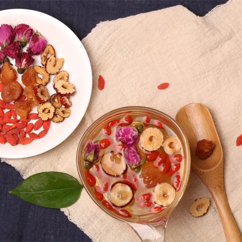 Herbal tea for cramps with jujubes, goji berries, and rosebuds to alleviate menstrual pain
