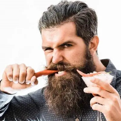 Bearded man enjoying herbal tea during golden hour for irregular diet health support