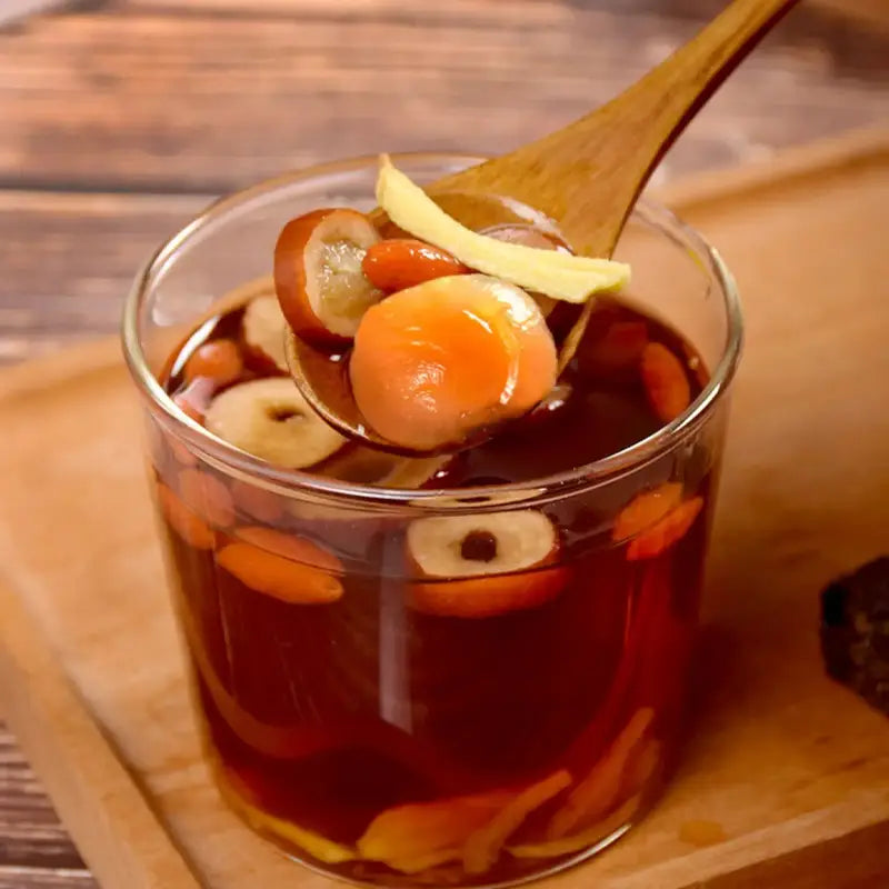Sweet herbal tea in a glass promotes blood circulation and alleviates menstrual pain