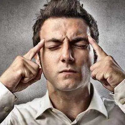 Concentrating man drinking herbal tea with pina date seed for better sleep quality