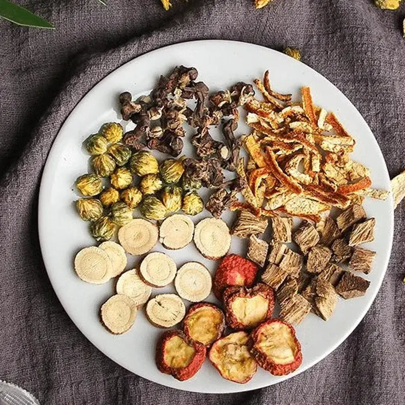 Assorted dried medicinal herbs including Hovenia Dulcis Thunb and tangerine peel with volatile oils