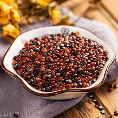Bowl of red quinoa with Hovenia Dulcis Thunb, tangerine peel, and volatile oils for health tea