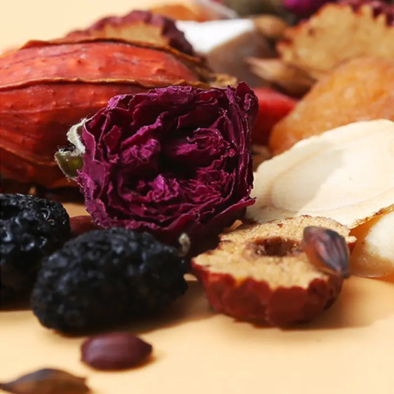 Dried floral and fruit medley for Sleep Tea, featuring Pina Date Seed herbal tea for better sleep quality