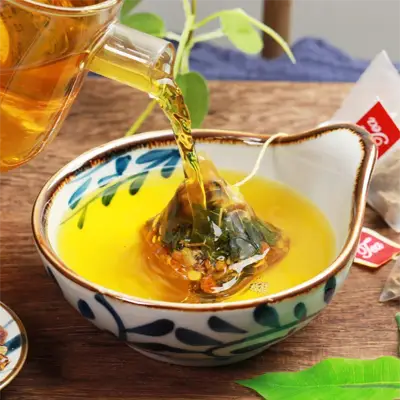 Poria Cocos herbal tea being poured into a bowl highlighting antioxidant properties