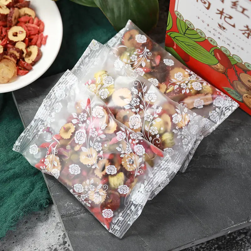 Packaged dried fruit and herbal tea ingredients for alleviating menstrual pain and promoting blood circulation