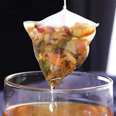 Fruit-filled herbal tea bag ideal for stomach health and irregular diet during golden hour