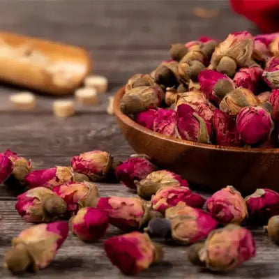 Dried rosebuds in herbal tea for cramps promoting blood circulation and alleviating menstrual pain