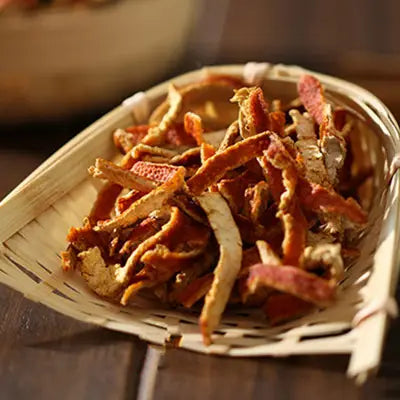 Dried orange peel strips with volatile oils for health-enhancing herbal tea including tangerine peel