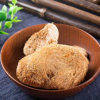 Lion’s Mane mushrooms in a wooden bowl for herbal tea to boost health during golden hour