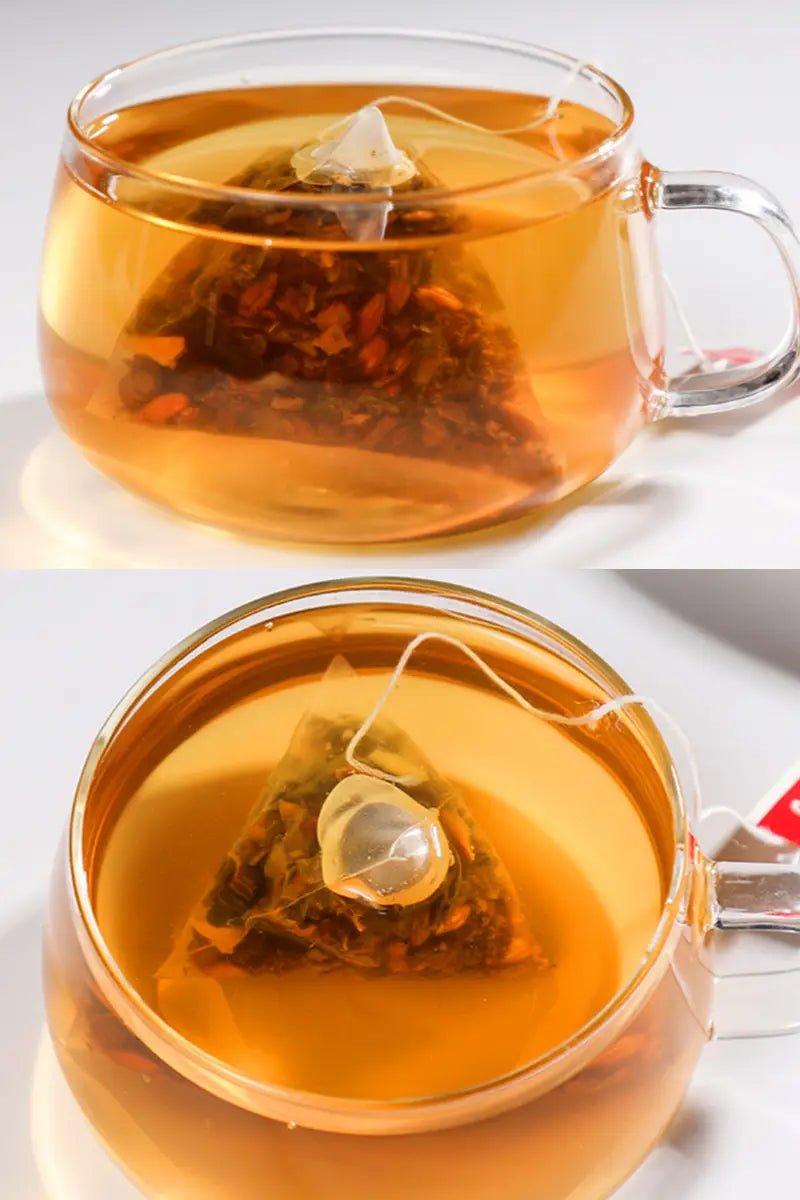 Two clear glass mugs with herbal tea and lotus leaf promote intestinal motility during golden hour