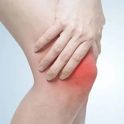 Inflamed knee with hand supporting detoxification herbal tea featuring tangerine peel for expulsion