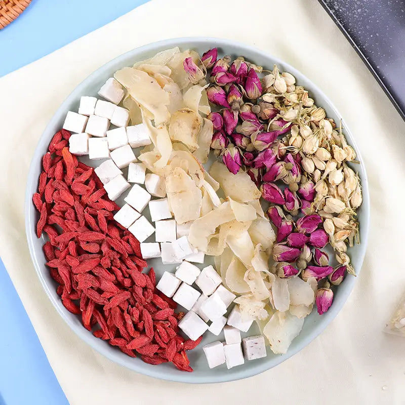 Assorted dried ingredients on a plate for Sleep Tea Herbal Tea to improve sleep quality