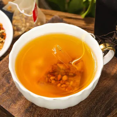 White teacup with tea bag featuring tangerine peel for supporting detoxification processes