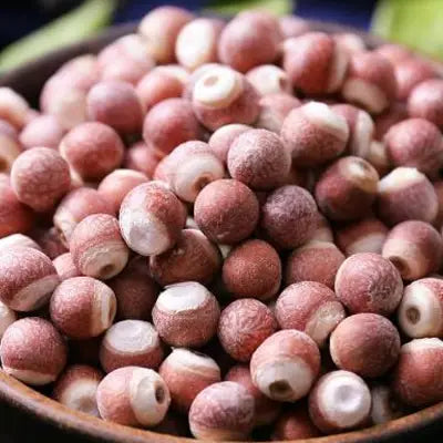 Pile of dried lotus seeds in herb tea for detox supporting detoxification processes