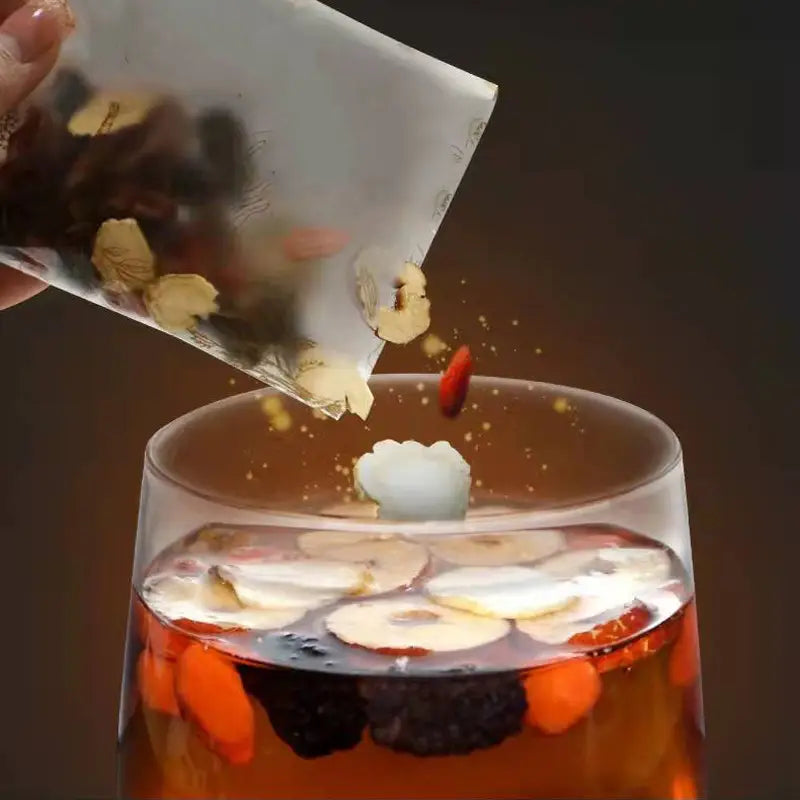 Herbal tea being poured into a glass for kidney health and renal protection