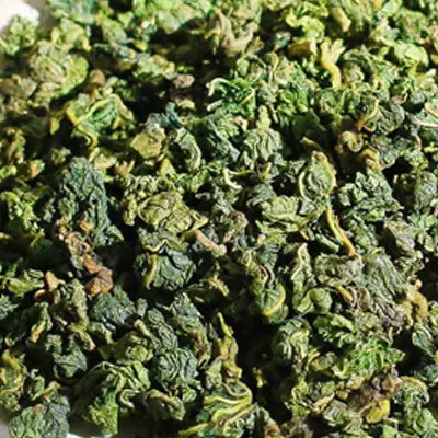 Dried green tea leaves with Poria Cocos for herbal tea and antioxidant benefits